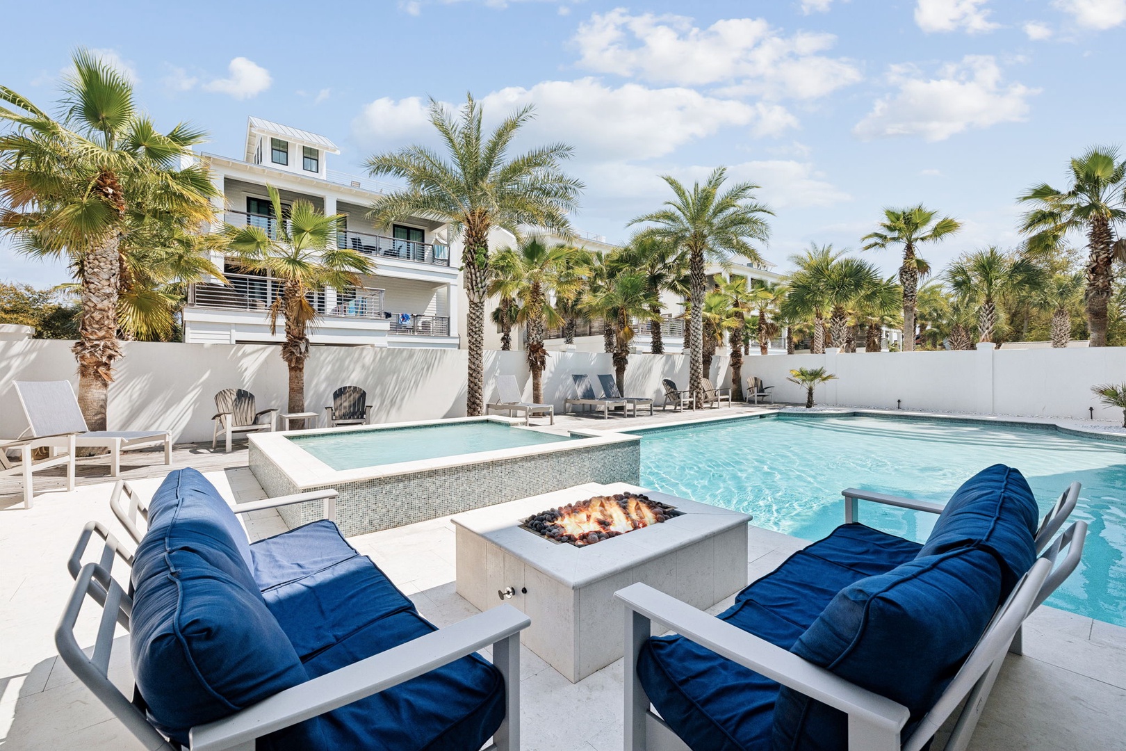 Unwind by your private pool with spa and fire pit, surrounded by swaying palms in this tropical paradise.