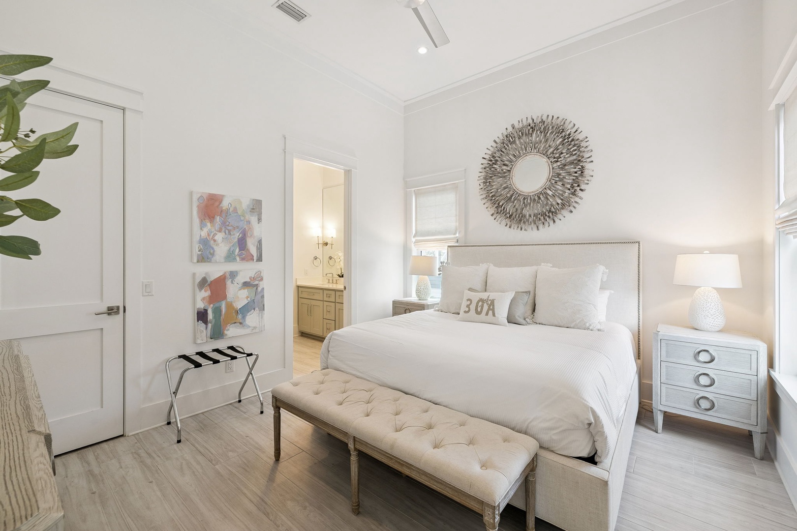 Your elegant bedroom sanctuary awaits with plush linens, calming neutral tones, and thoughtful touches for your perfect retreat.