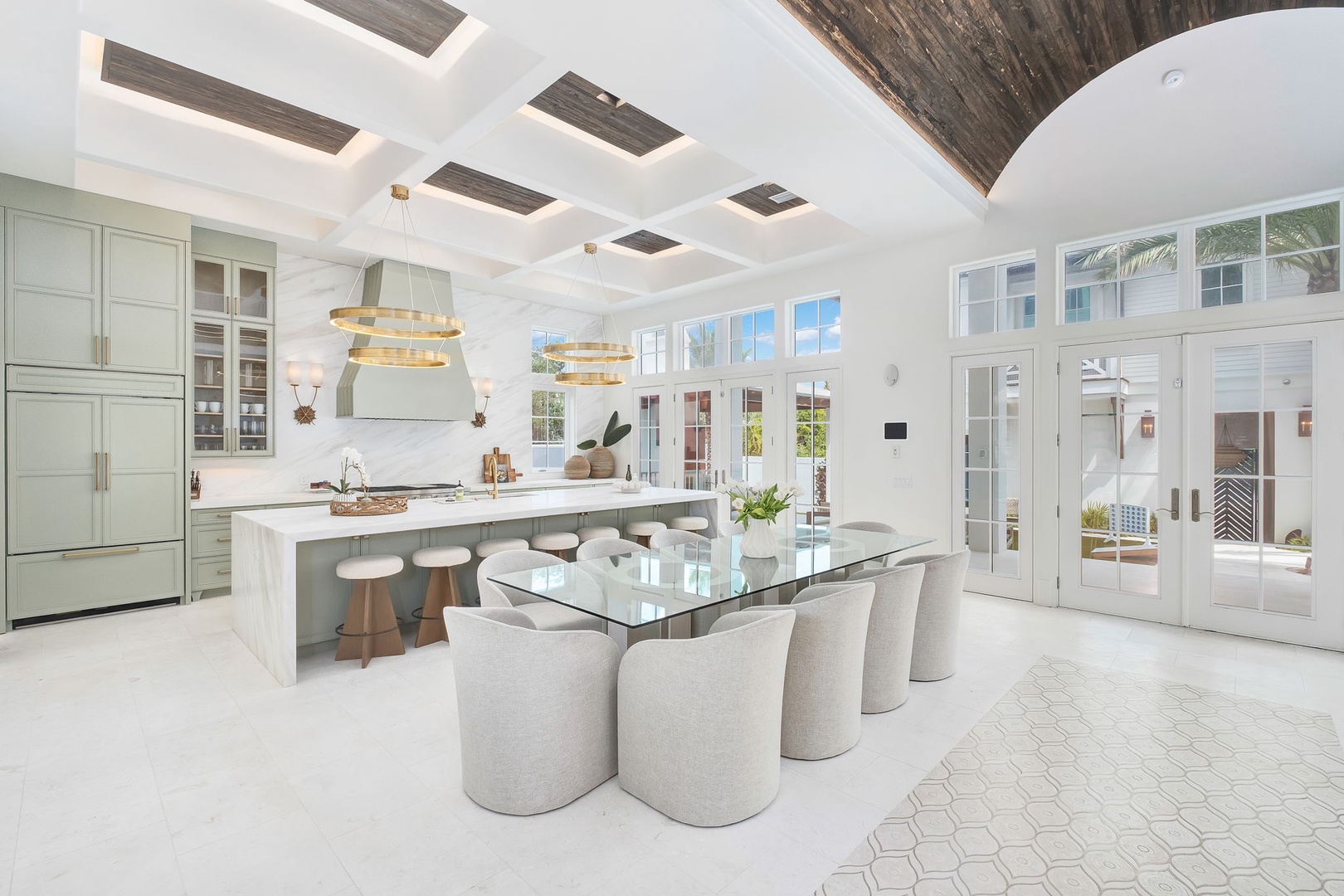 Step into a bright, airy space where soaring ceilings and elegant design invite you to gather, cook, and unwind in coastal luxury.