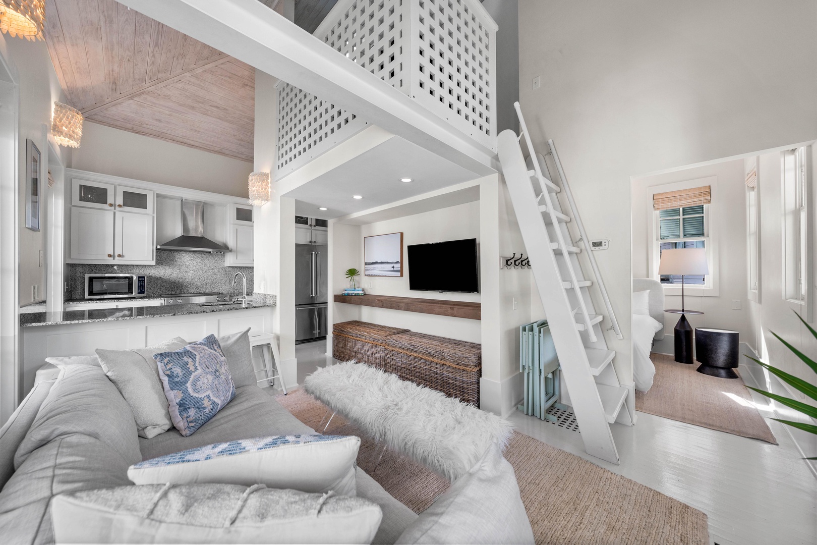Relax in your stylish loft with plush seating and climb up to the cozy sleeping nook above for peaceful nights.