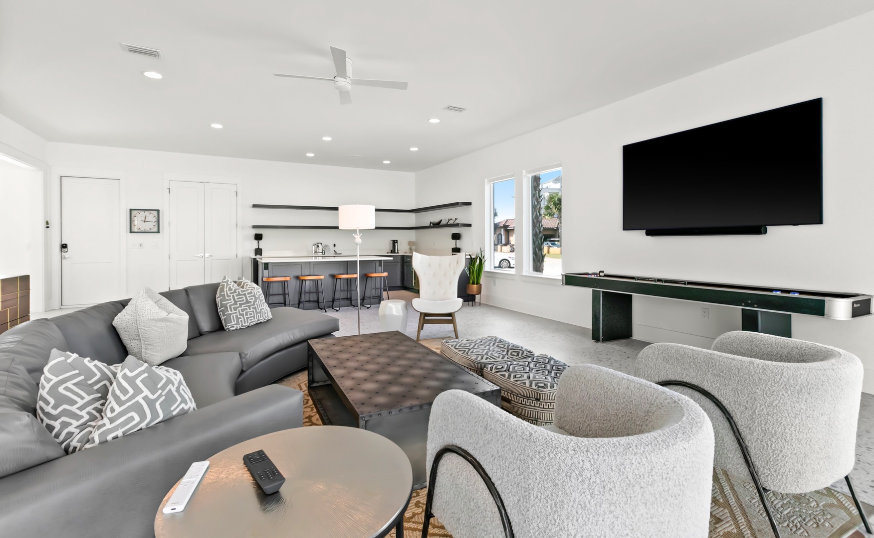 Sink into plush seating in this bright, open-concept living space, where your group can gather under high ceilings with a modern kitchen just steps away.