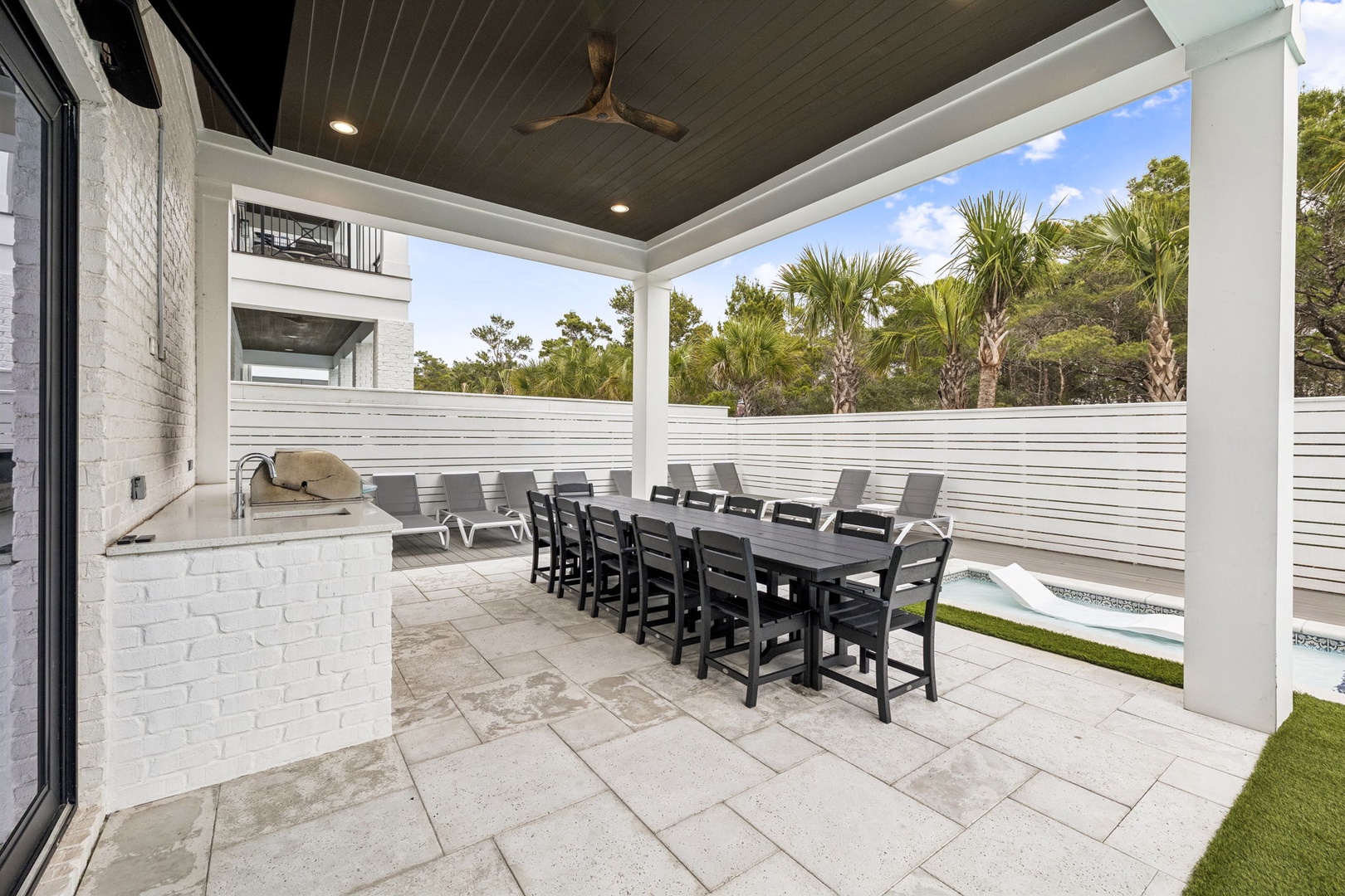 Gather around your private outdoor kitchen and dining space, where family meals become memorable moments under the covered patio.