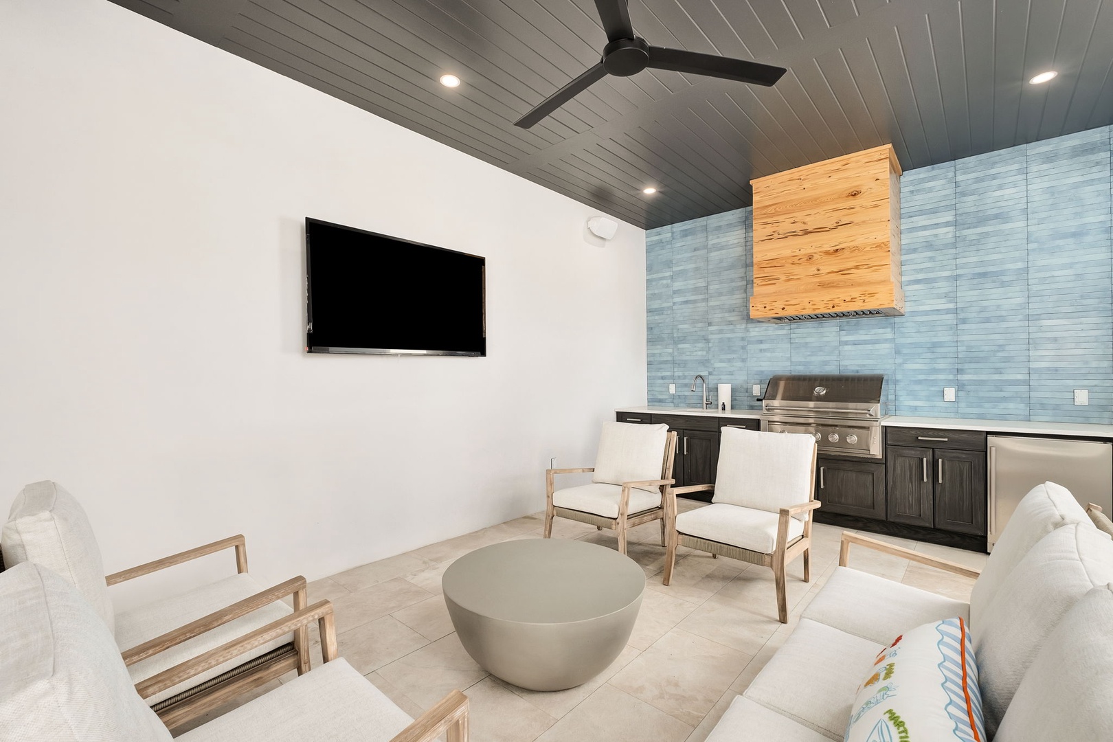 Relax in your modern outdoor living space with sleek seating, entertainment, and full outdoor kitchen for perfect alfresco evenings.