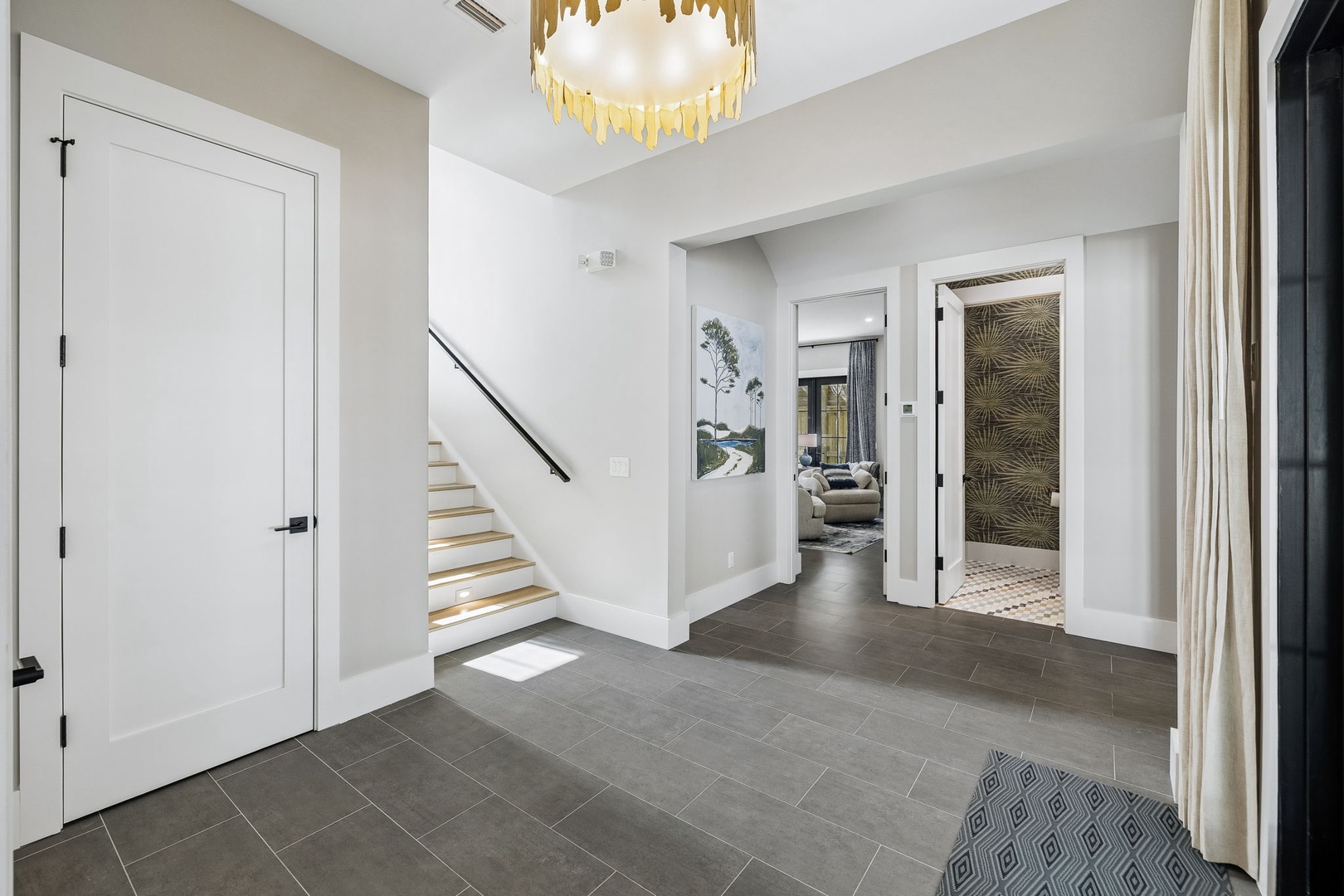 Step inside to a bright, open entryway with sleek tile floors and elegant details that make you feel instantly at home.