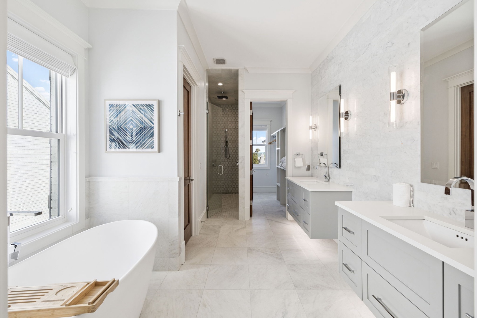 Unwind in your luxurious marble bathroom with dual vanities, soaking tub, and elegant finishes creating your personal spa retreat.