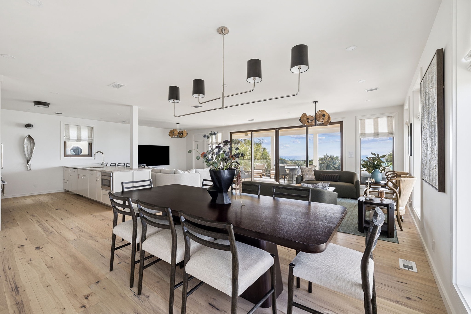 You'll love dining in this bright open space where modern elegance meets comfort, with stunning views creating the perfect backdrop for memorable meals.