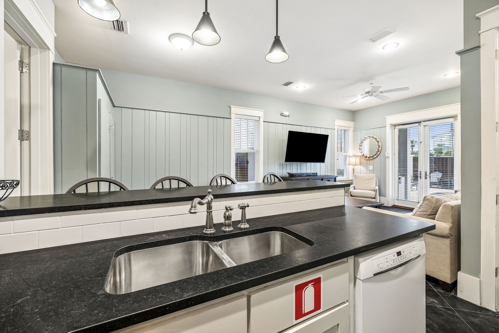 Step into your bright, open-plan retreat where soothing coastal colors and modern finishes create the perfect setting for your getaway. The sleek kitchen seamlessly flows into the inviting living space, ready for shared meals and cozy evenings.