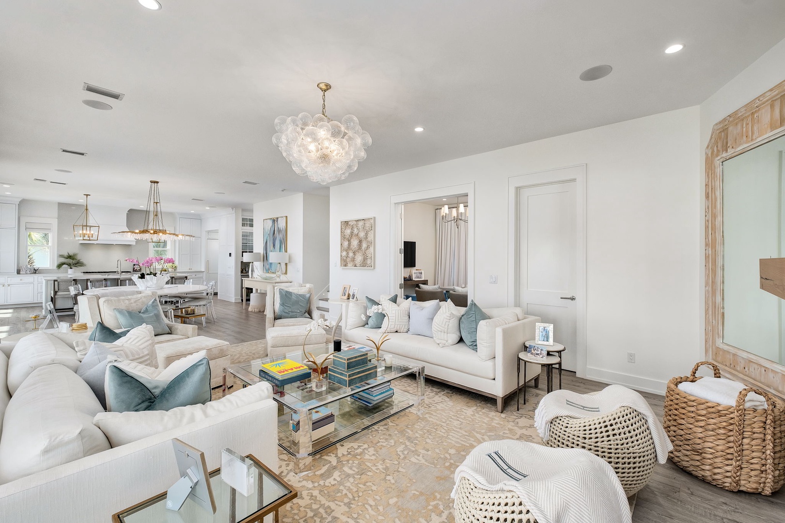 Picture yourself relaxing in this beautifully designed open living space, where soft textures, elegant lighting, and coastal-inspired accents create your perfect home away from home.