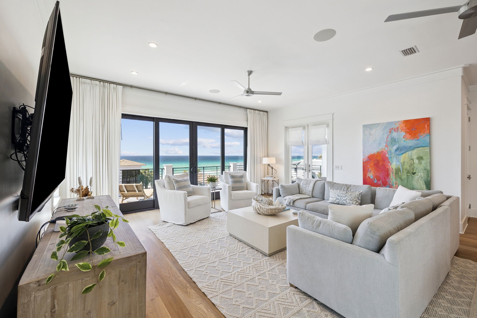 Sink into plush seating while ocean breezes flow through your bright, airy living space with stunning sea views.