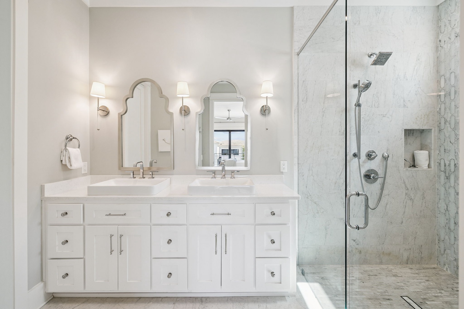 Step into your private spa-like retreat with dual vanities, marble finishes, and a luxurious walk-in shower.
