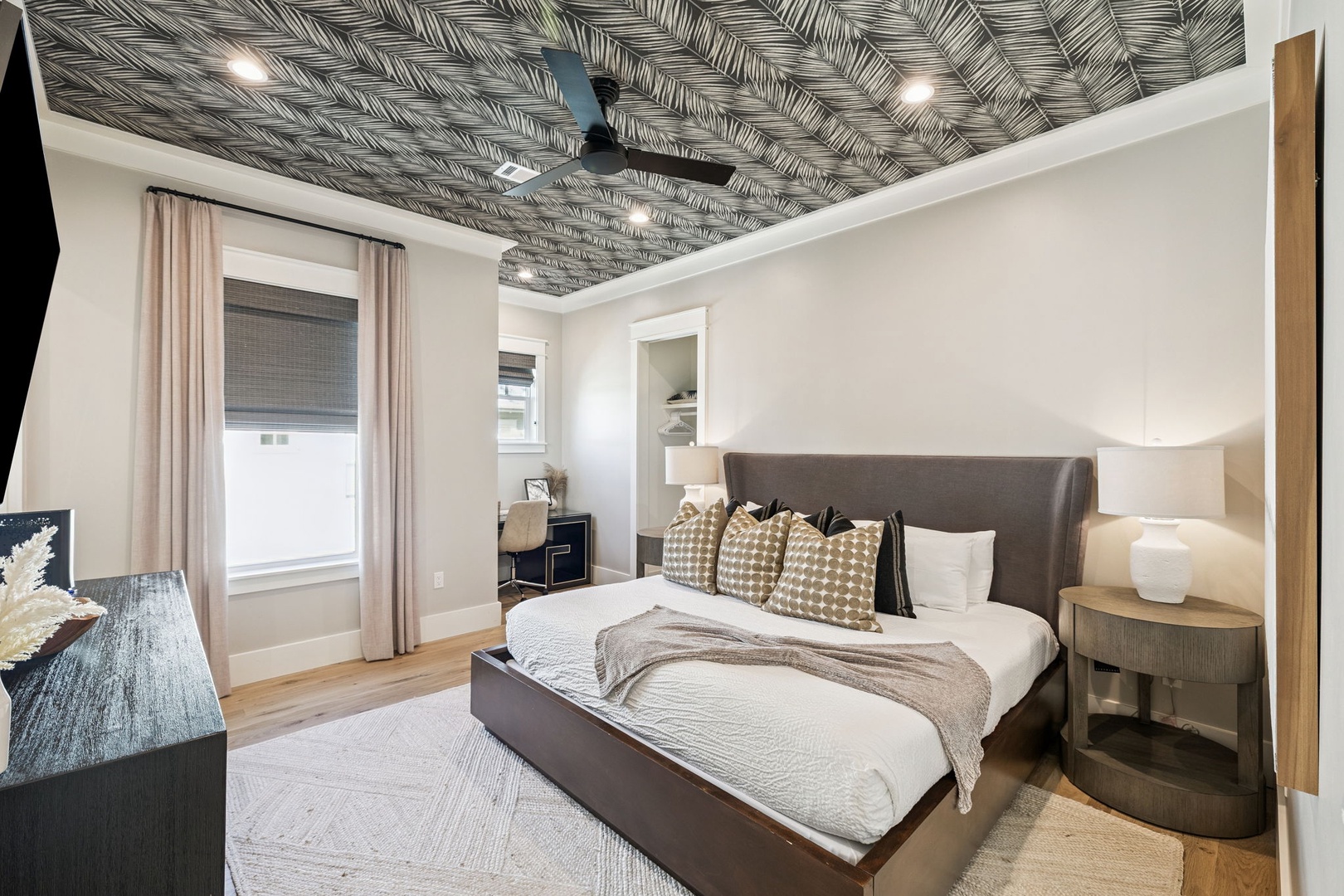 Drift into restful sleep beneath your stunning wallpapered ceiling, where modern comfort meets artistic design in this beautifully appointed bedroom.