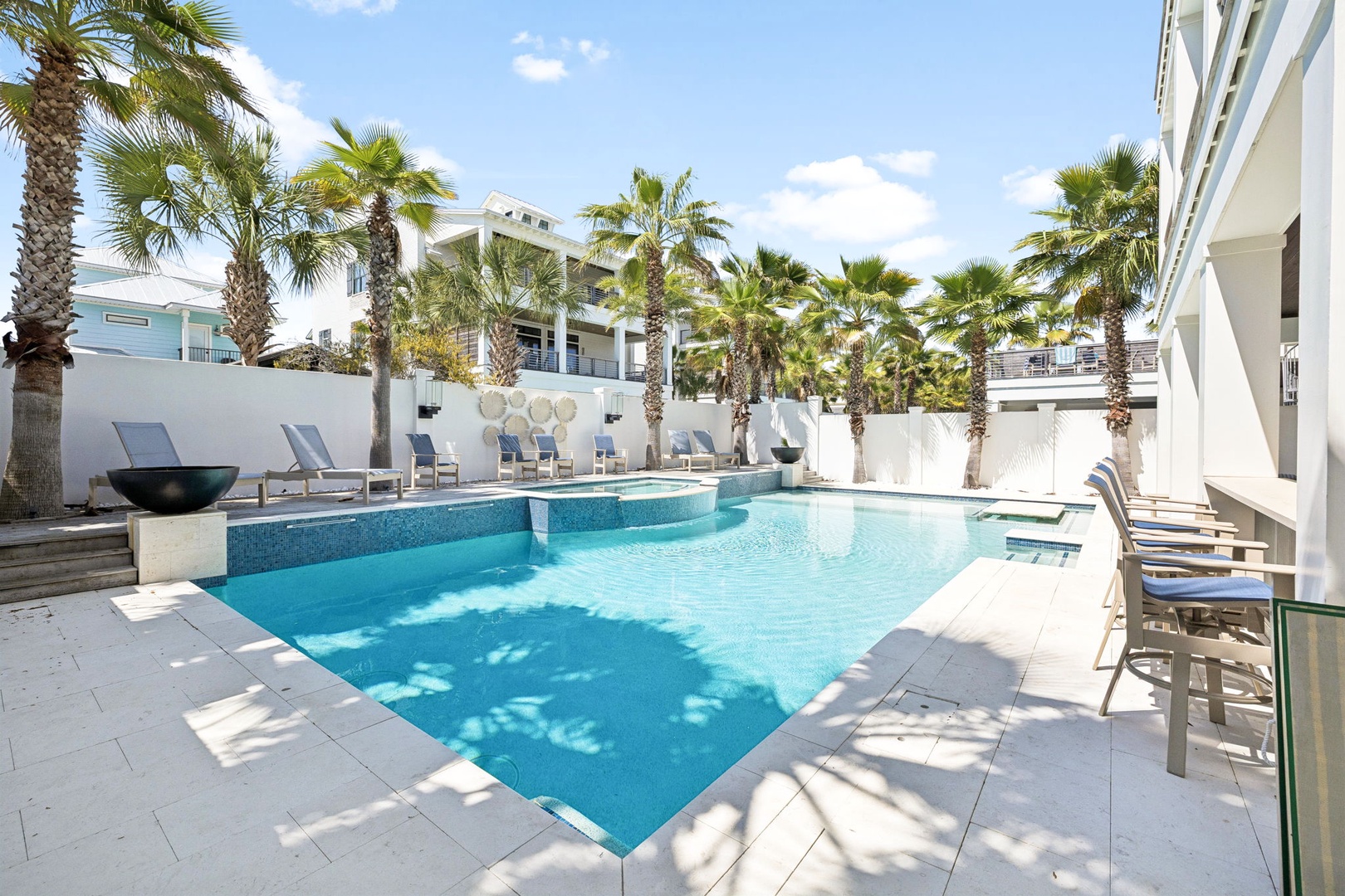 Dive into your private tropical oasis, where crystal-clear waters and swaying palms create the perfect backdrop for your sunny escape.