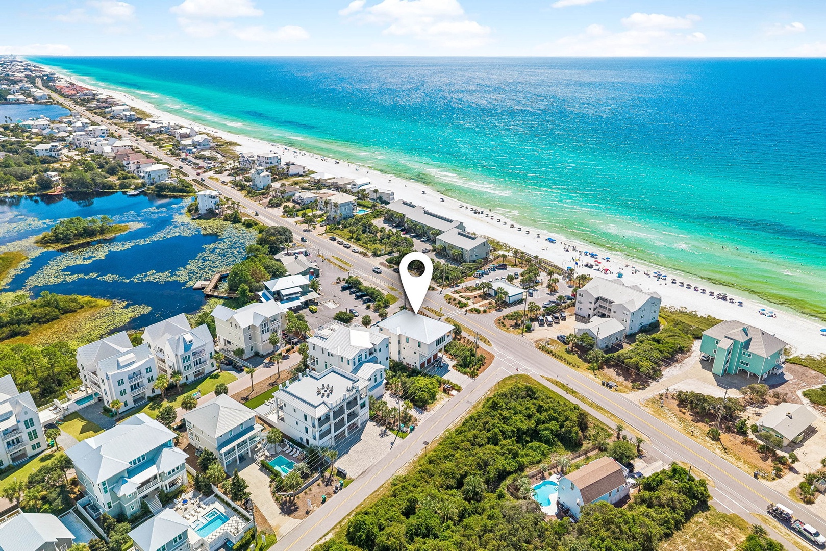Stunning aerial view of a pristine beachfront neighborhood, with turquoise Gulf waters and sugar-white sand just steps away. Your coastal escape awaits in this idyllic seaside community.