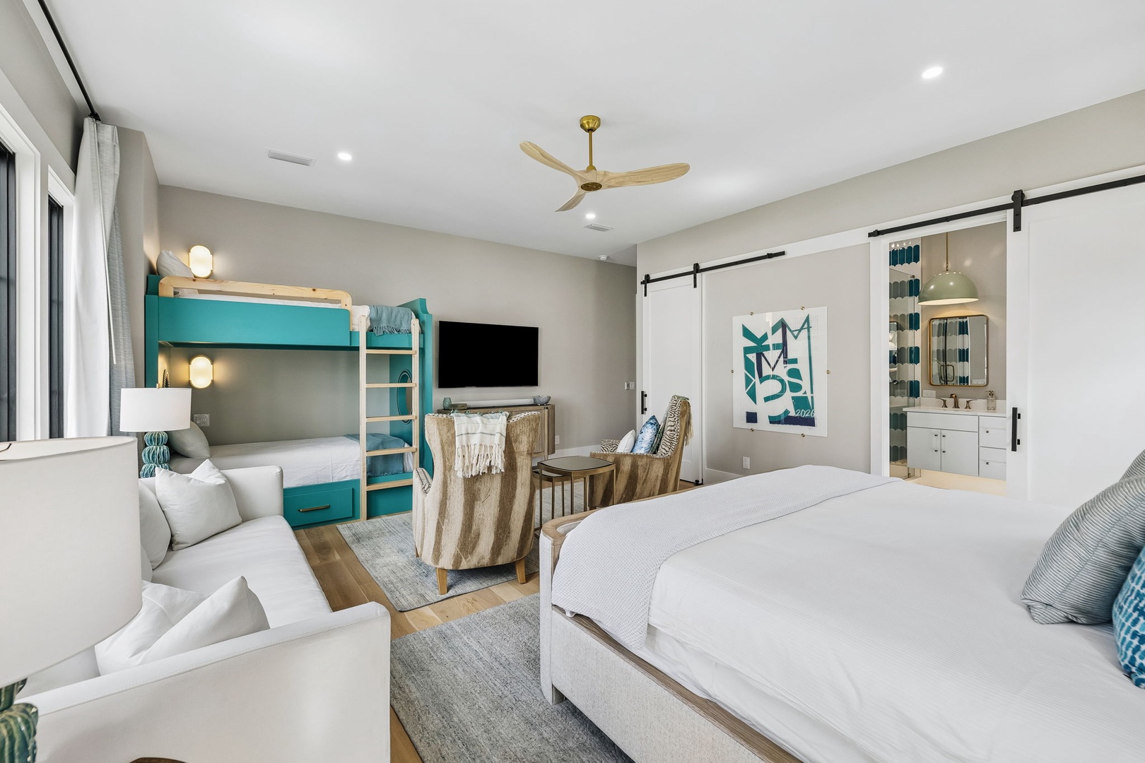 Spacious and thoughtfully designed, your room offers crisp white linens, a cozy bunk bed for kids, and a private barn-door ensuite. Perfect for families seeking comfort and style.