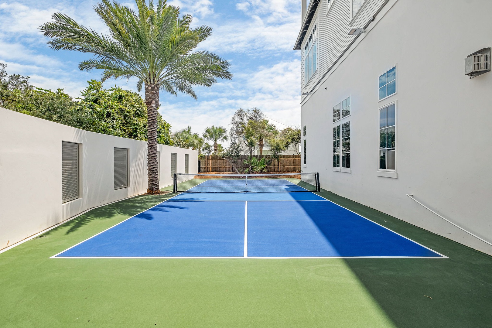 Challenge yourself to a match on your private tennis court, framed by tropical palms and sunny skies—your own slice of resort-style living.