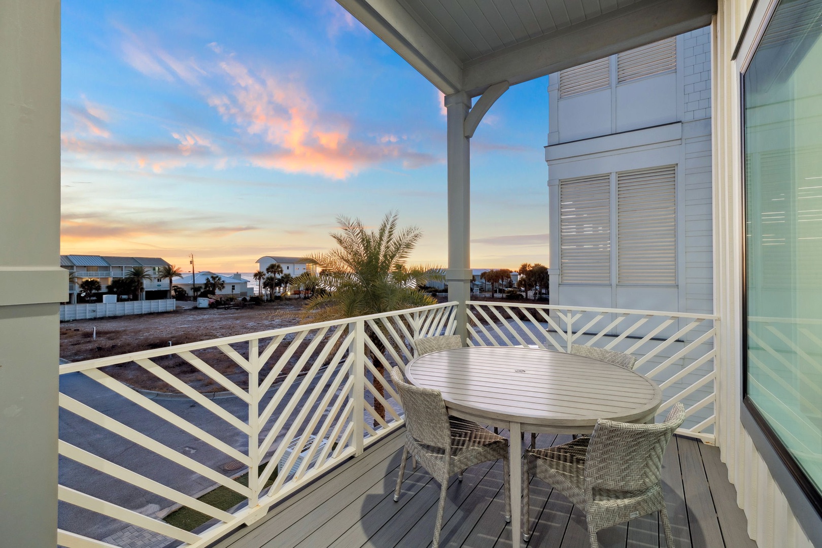 Unwind on your private deck as golden sunsets paint the sky, with coastal views stretching beyond palm trees.
