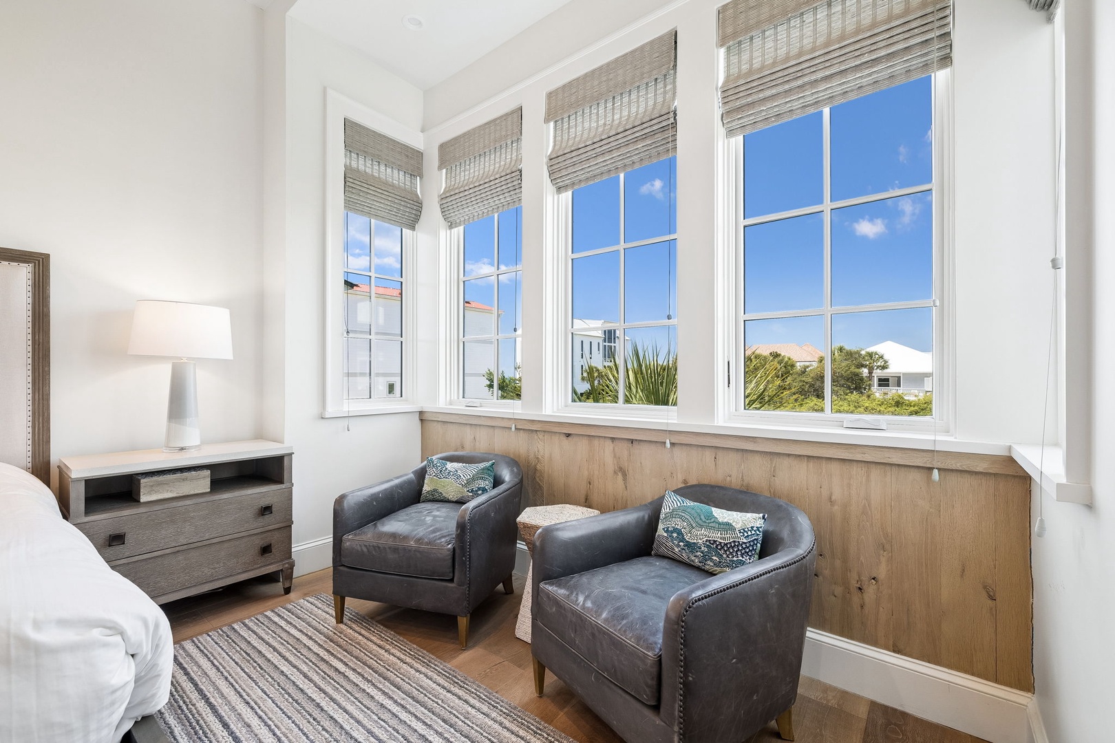 Sink into cozy leather chairs and soak up abundant sunshine streaming through oversized windows. Your perfect spot to unwind with a book or enjoy morning coffee.