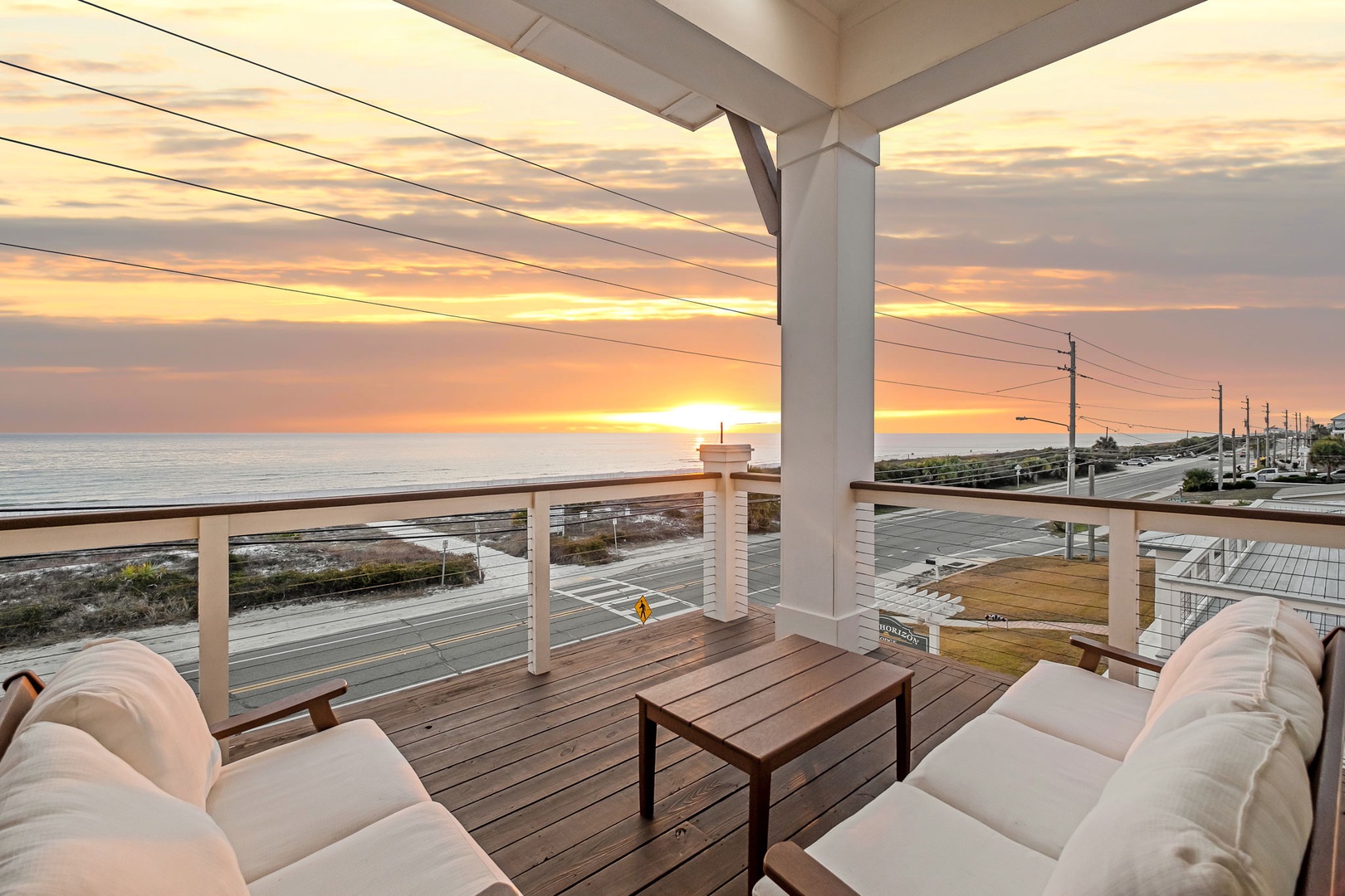 Breathtaking oceanfront deck with plush seating where you'll savor morning coffee and evening sunsets over endless sea views.