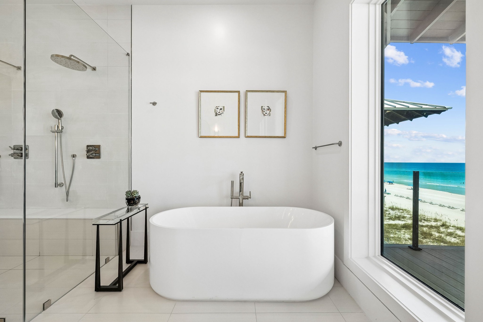 Unwind in your elegant soaking tub with a stunning real beach view, or refresh under the rainfall shower—coastal serenity at its finest.