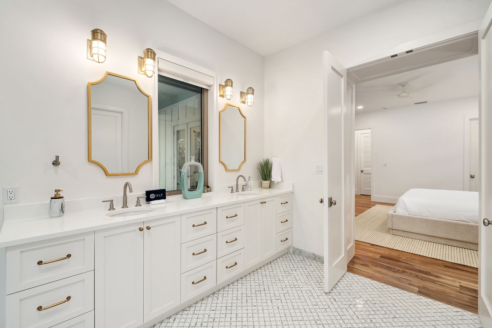 Step into your luxurious master bathroom with elegant double vanities, gleaming marble countertops, and warm brass accents that create a spa-like retreat.