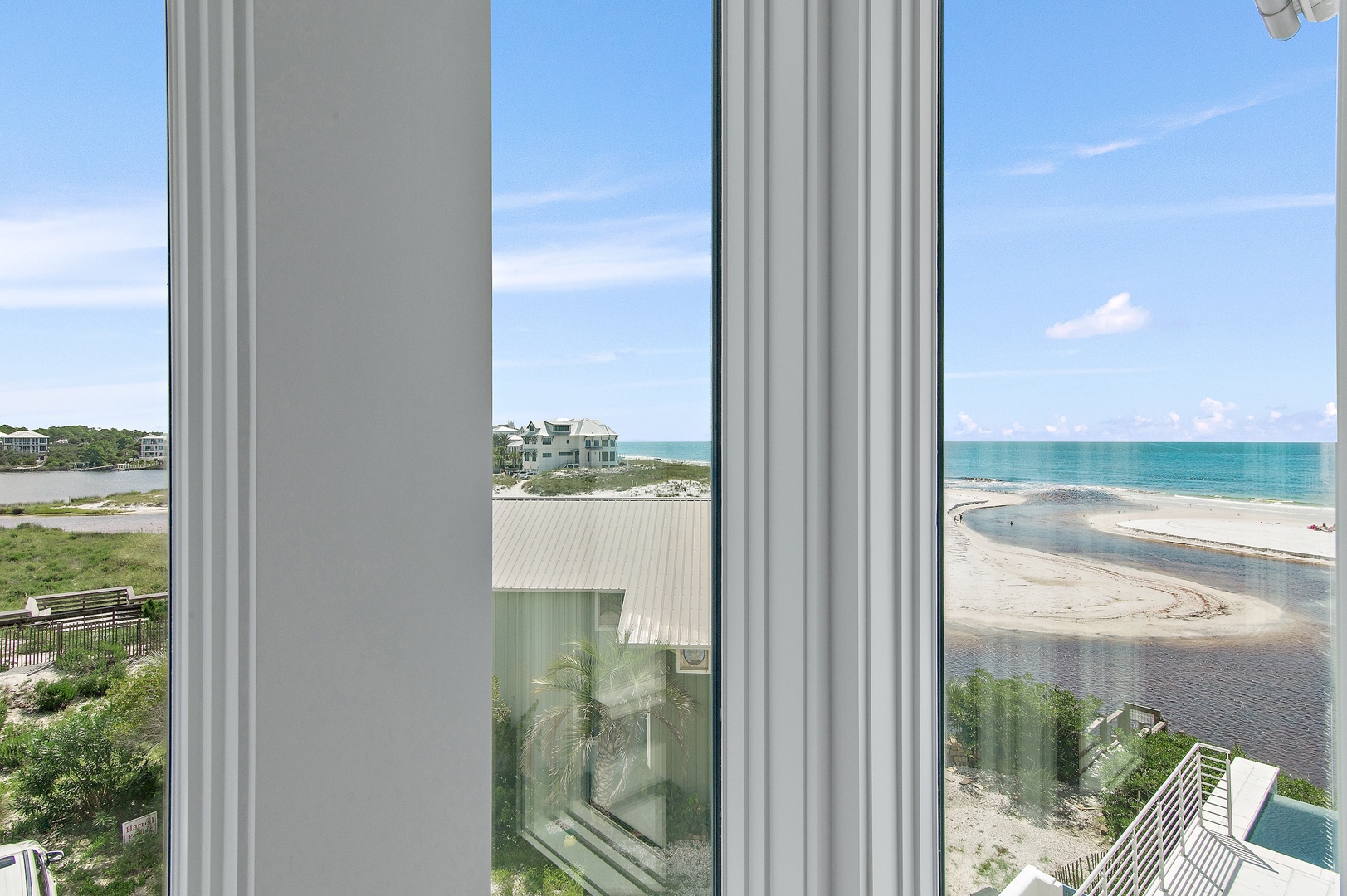 Take in breathtaking turquoise waters and sandy shoreline through your floor-to-ceiling windows, where every glance offers a stunning coastal escape just beyond the glass.