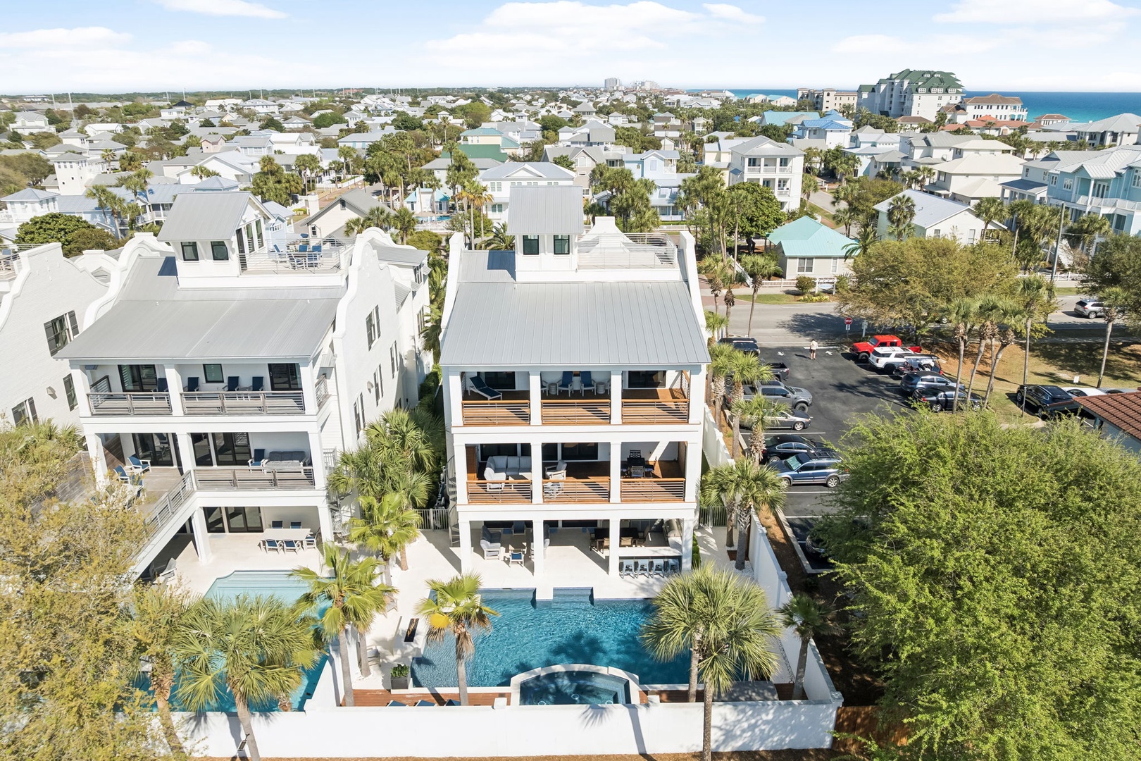 Stunning coastal property featuring multiple levels of oceanside luxury with private pool and hot tub in a charming beach community.