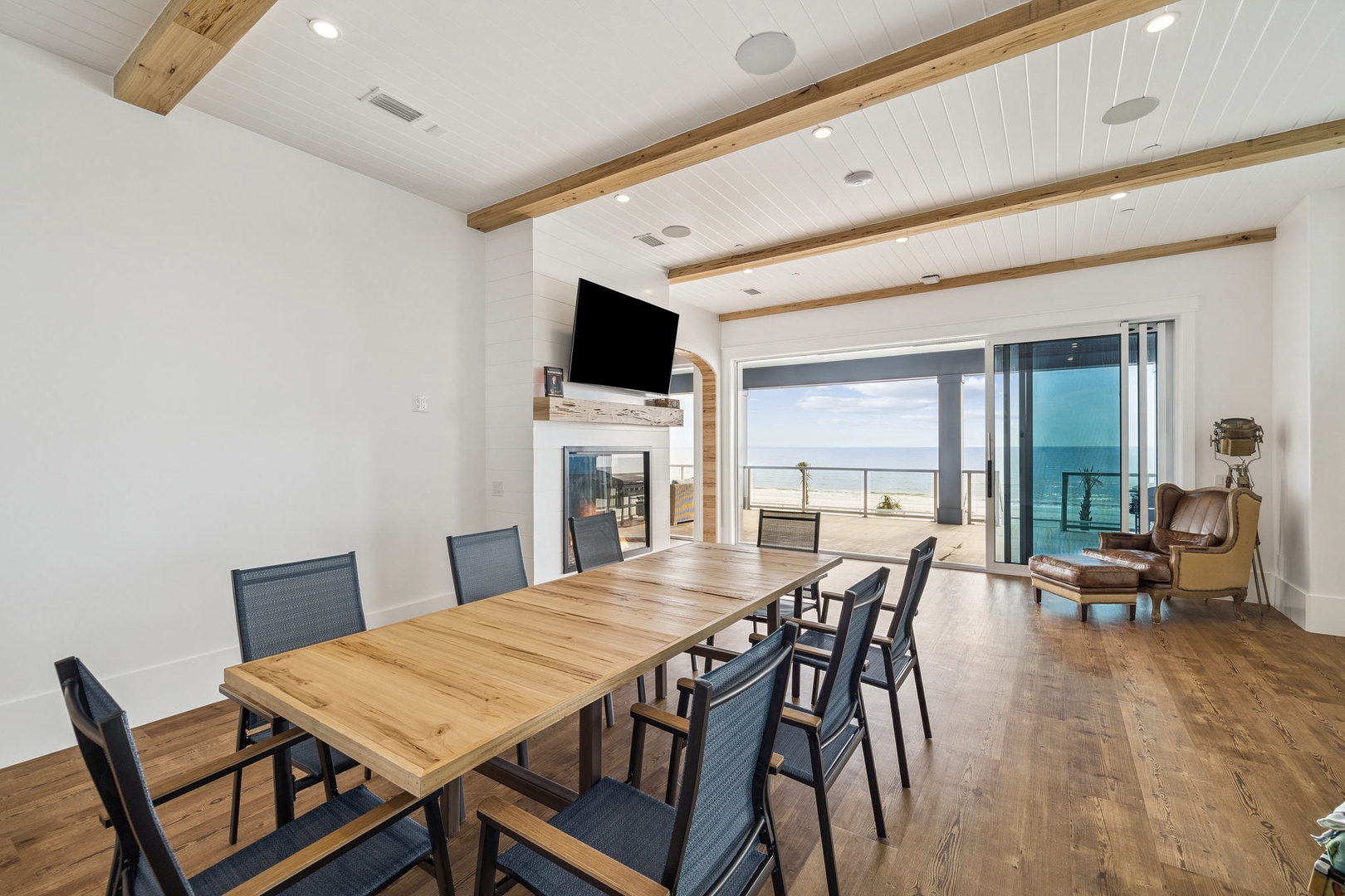 Gather around your stunning dining table while ocean views frame every meal through floor-to-ceiling windows.