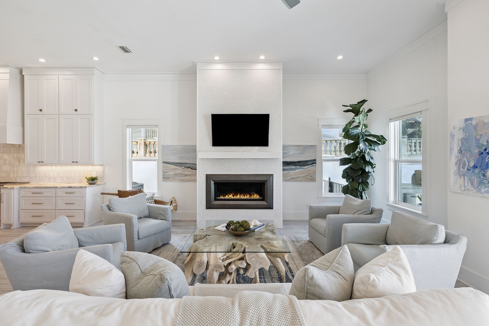 Sink into plush seating around your crackling fireplace, where soft textures and warm lighting create the perfect retreat for relaxing evenings.