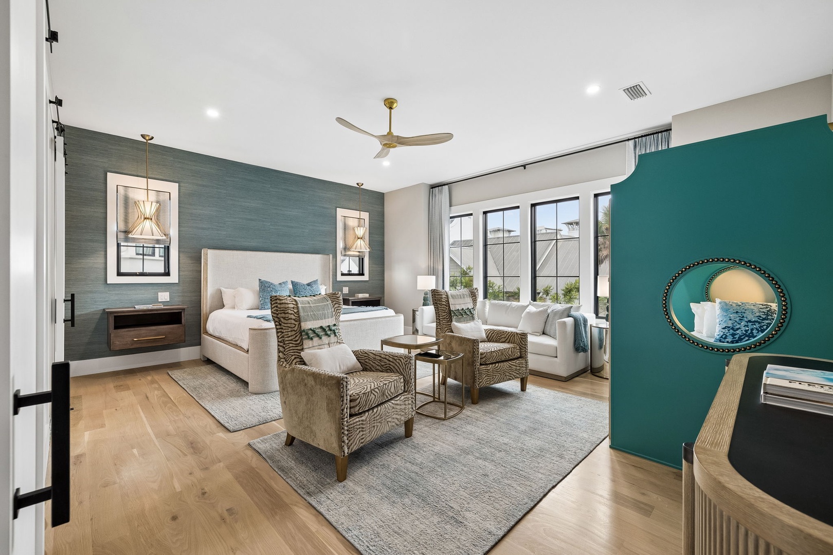 Picture yourself unwinding in this stylish, open suite where coastal blues and warm woods create your perfect retreat. Sink into the seating area or drift off in the plush bed surrounded by serene colors.