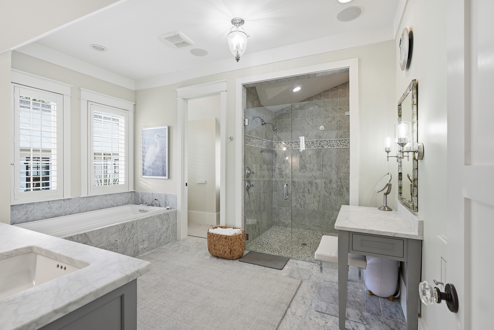 Imagine unwinding in your spa-like bathroom with marble accents, a soaking tub, a spacious walk-in shower, and natural light filling the room—your perfect retreat.