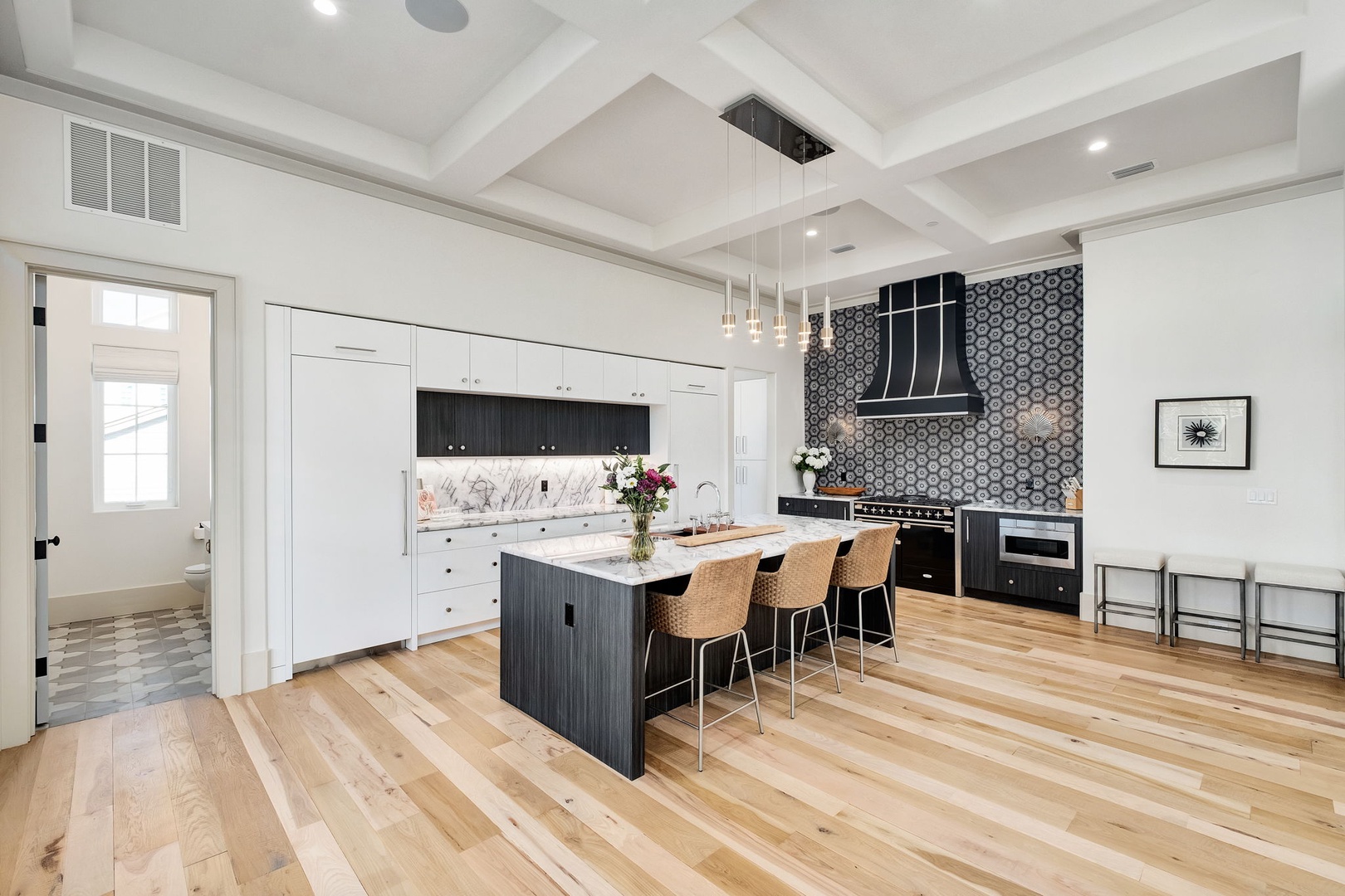 Your gourmet kitchen awaits with sleek appliances, a spacious island for cooking together, and beautiful hardwood floors underfoot.