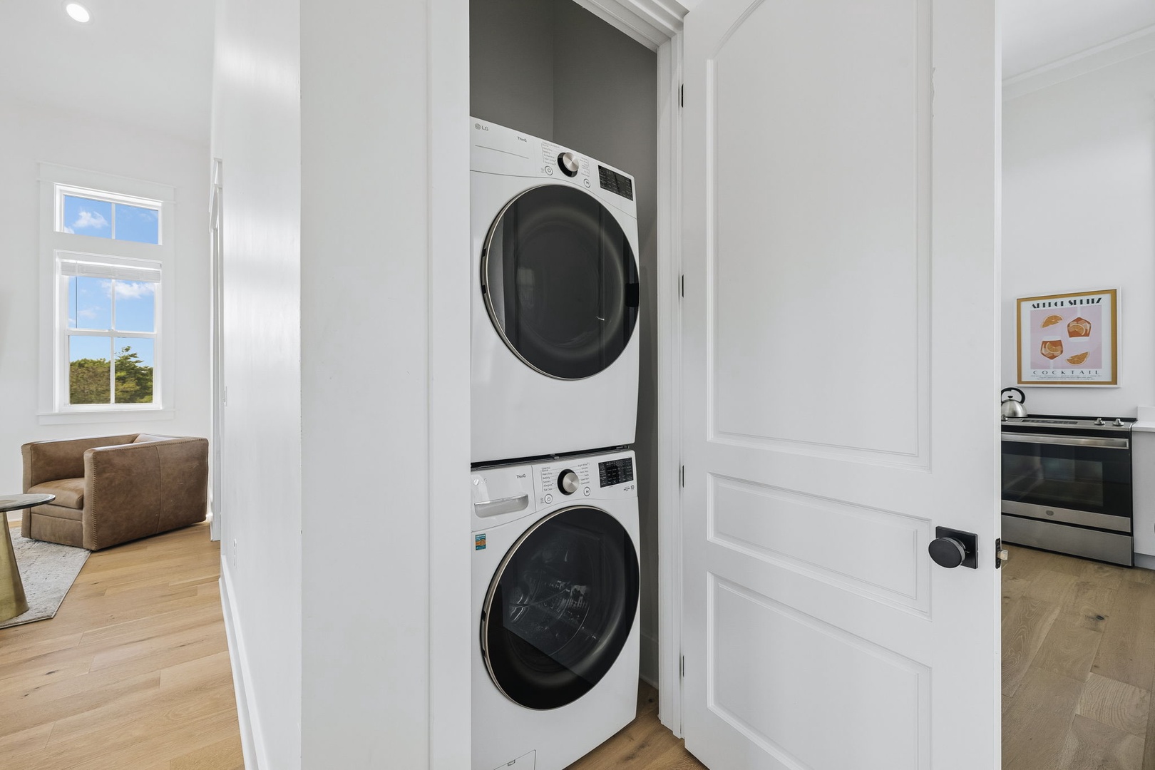 Your vacation days stay carefree with stacked washer and dryer tucked into a sleek closet, keeping your wardrobe fresh without leaving the comfort of home.