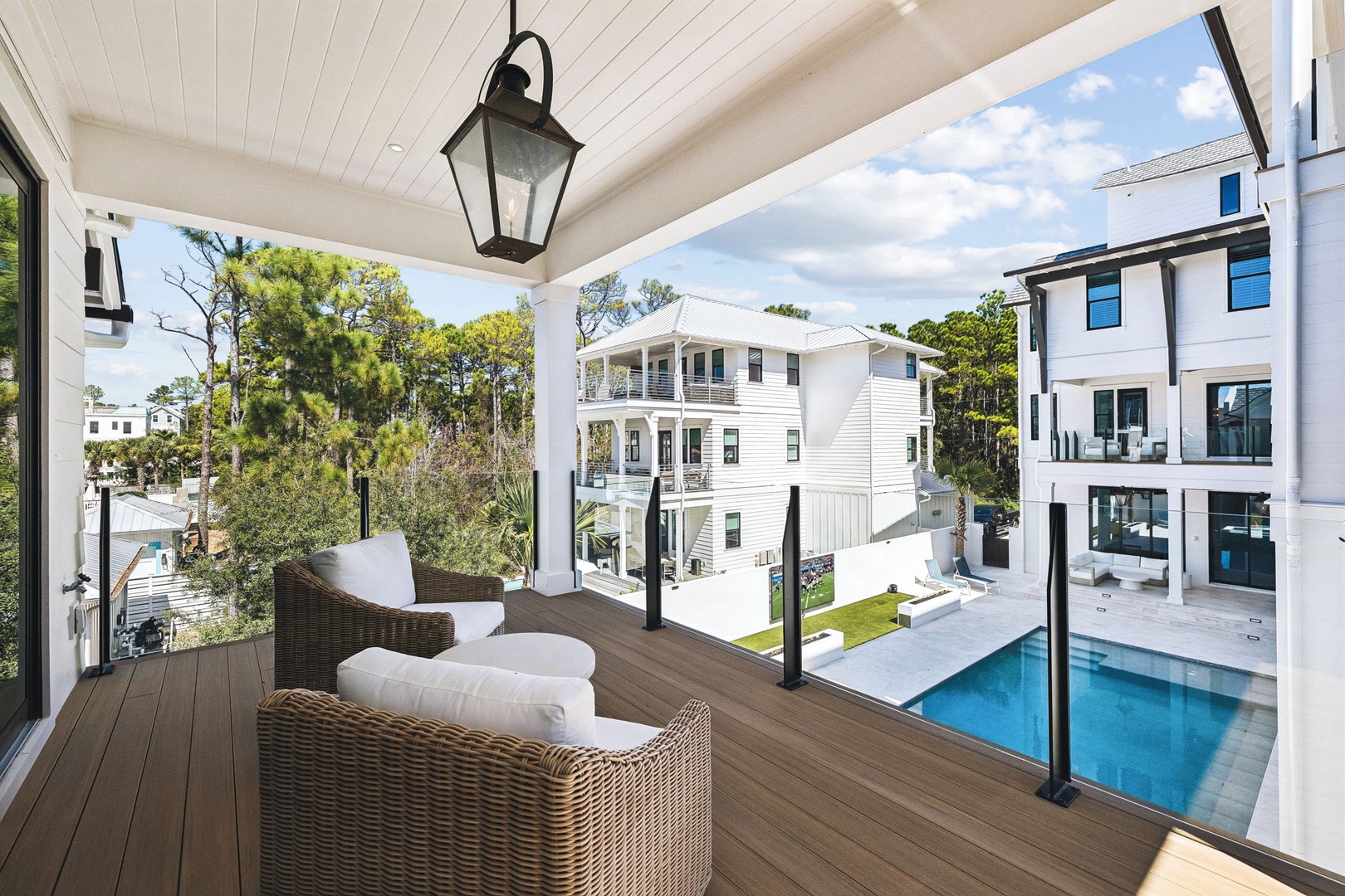 Settle into plush seating on your private balcony, where the sparkling pool below and coastal beauty beyond create the perfect backdrop for your morning coffee or evening wine.