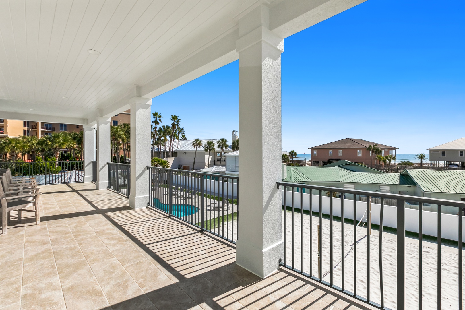Step onto your private balcony and breathe in the coastal air, with palm trees swaying nearby and glimpses of the sparkling ocean in the distance inviting you to relax and unwind.