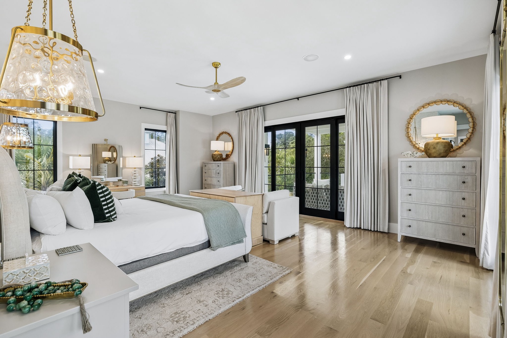 Your serene bedroom sanctuary awaits with elegant finishes, abundant natural light, and peaceful garden views through French doors.