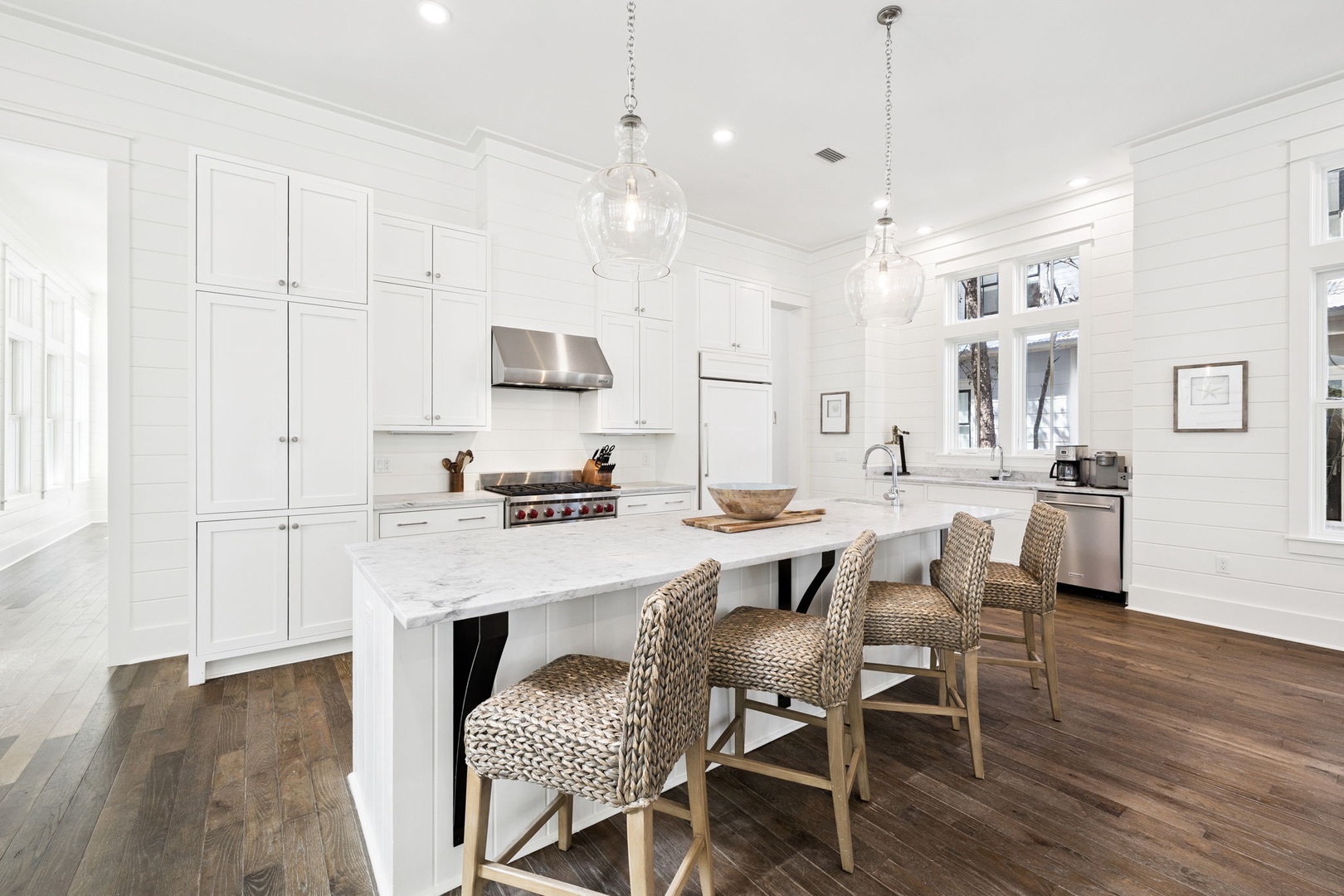 Your spacious kitchen features marble countertops, stainless steel appliances, and a perfect island for morning coffee or casual meals together.