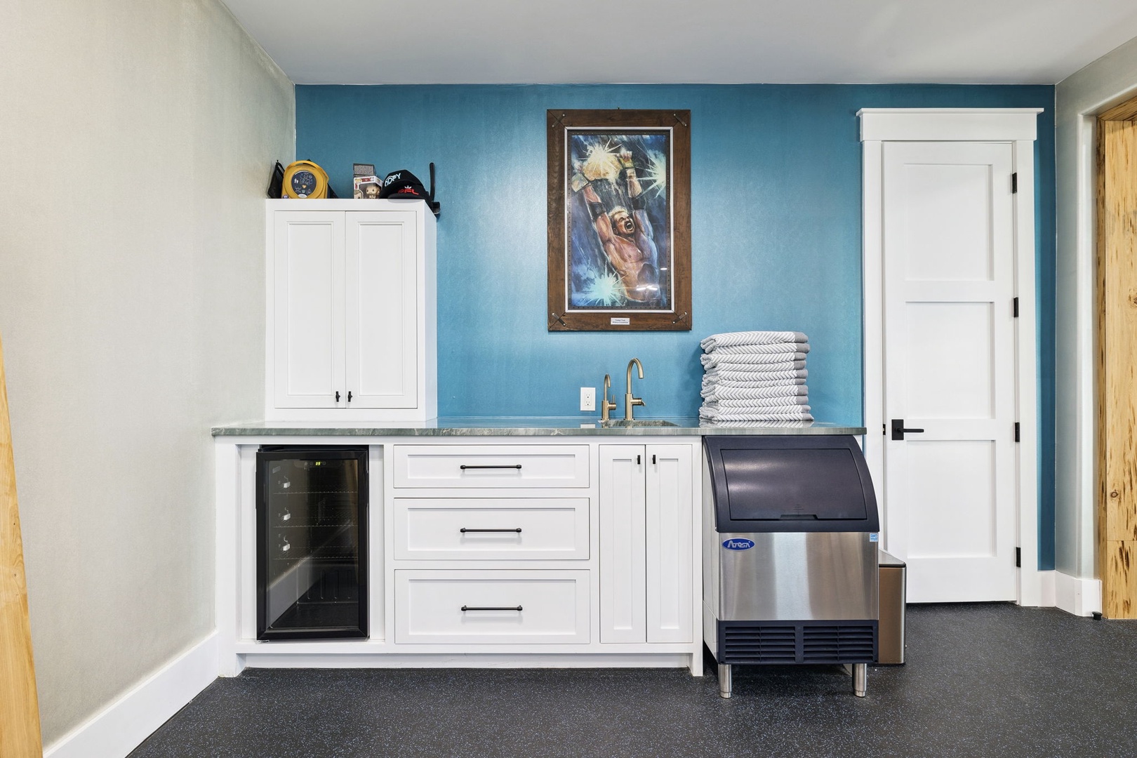 Your private kitchenette features crisp white cabinetry and modern appliances, perfect for preparing refreshing drinks after your adventures.