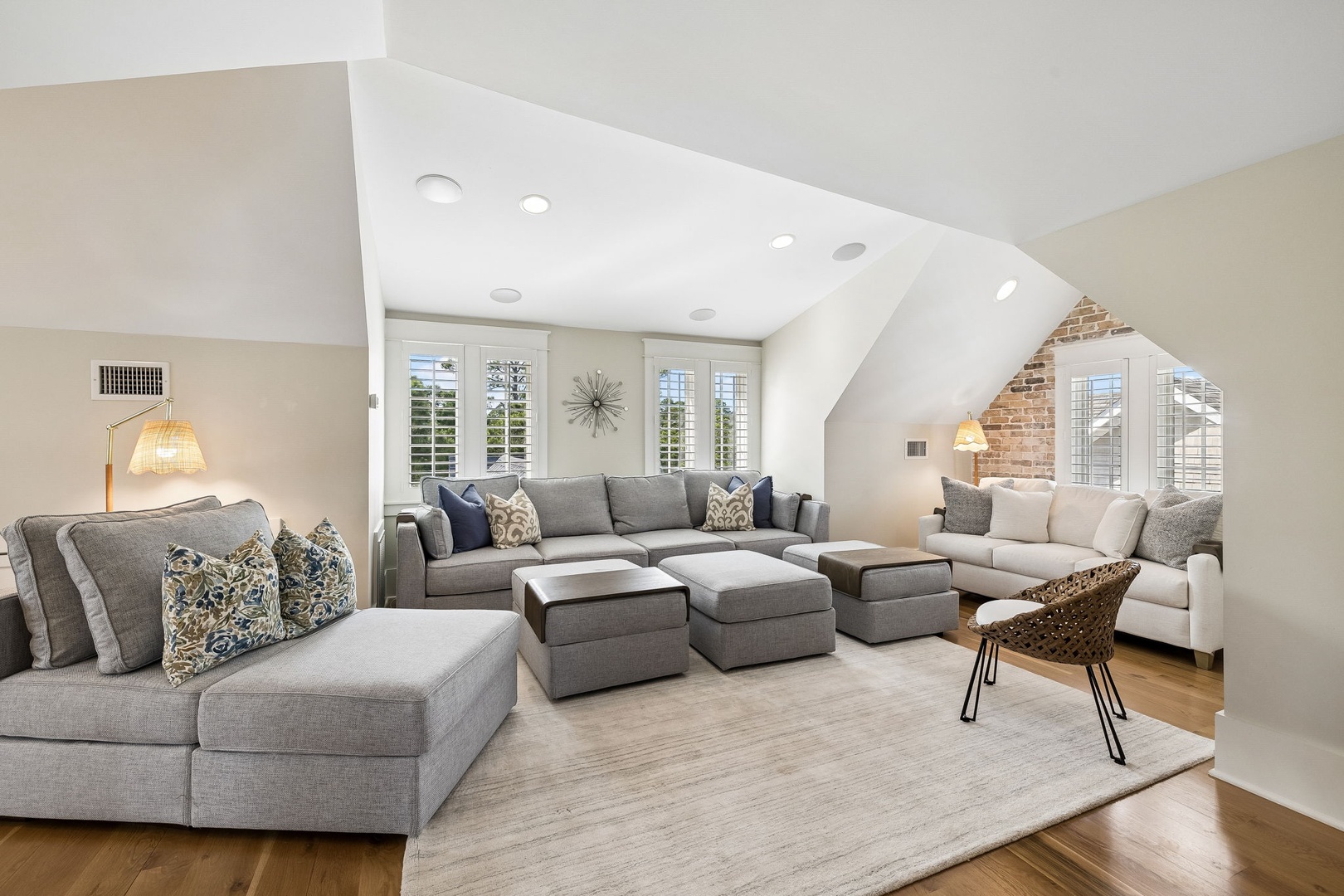 Unwind in your spacious living room, where vaulted ceilings and soft natural light create an airy, inviting retreat perfect for lounging with loved ones.