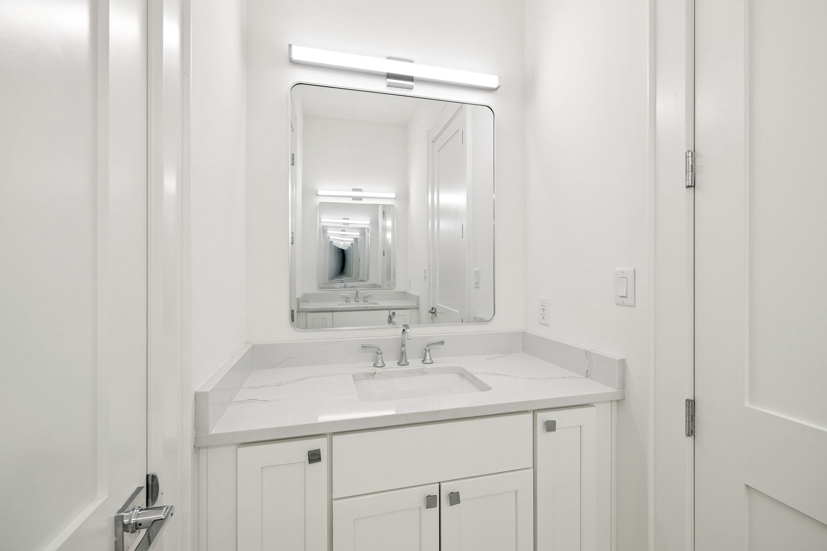 Step into your pristine bathroom where marble countertops and elegant fixtures create a spa-like retreat for your daily rituals.