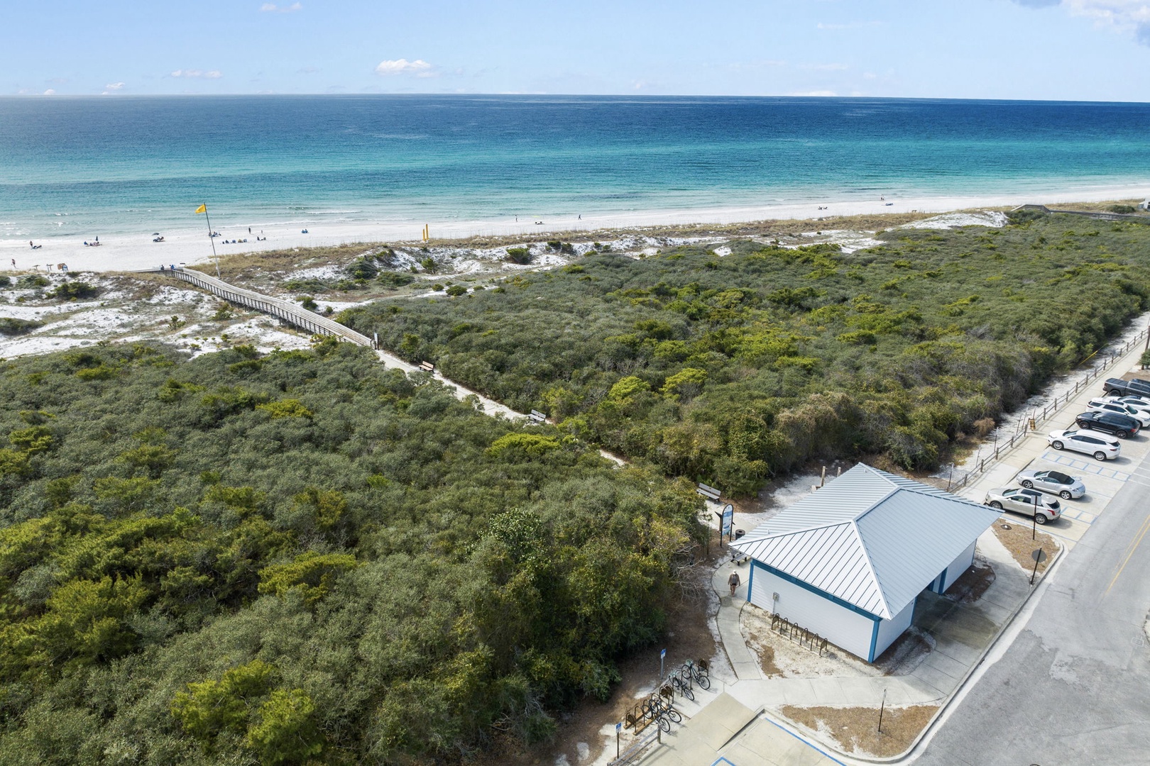 Pristine beachfront location with direct access to turquoise waters and white sand beaches via elevated boardwalk.