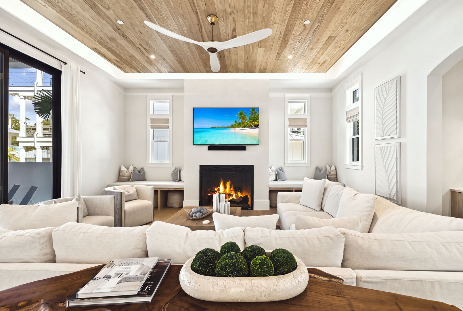 Unwind in your elegant living space, where plush seating, a cozy fireplace, and warm wood accents create the perfect retreat for relaxation.