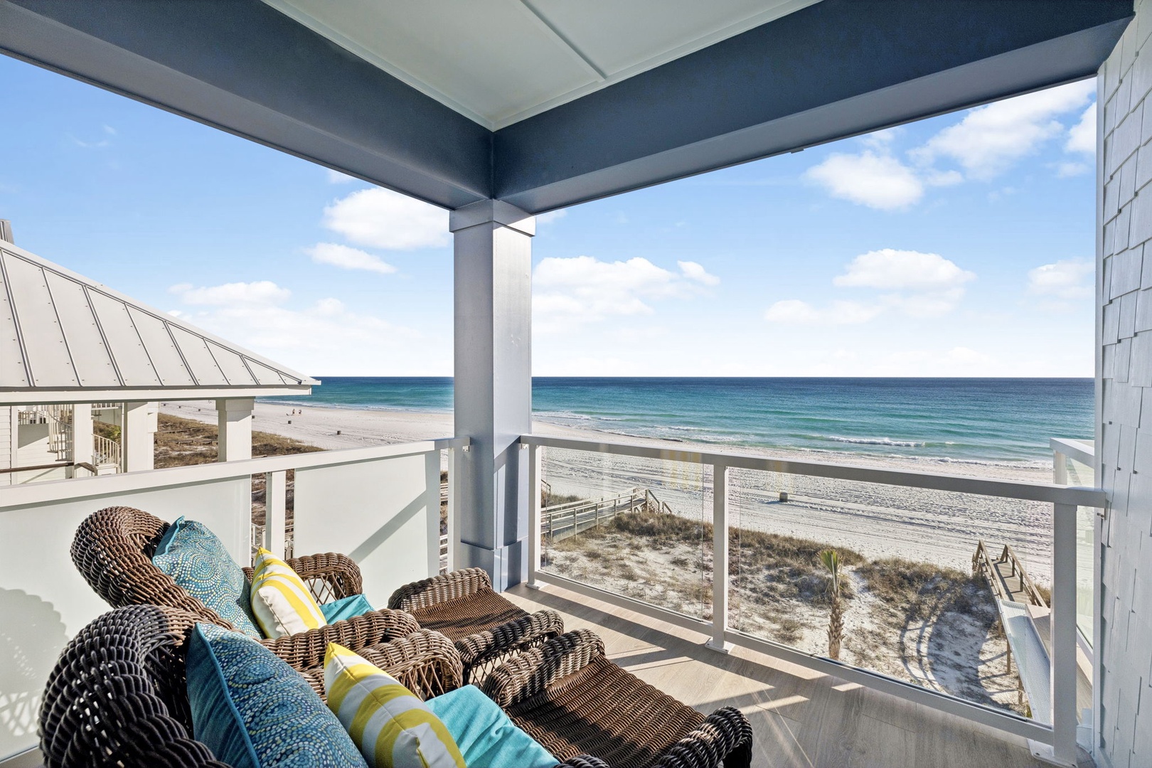 Sink into comfortable wicker seating on your private covered balcony and let the endless ocean views wash your worries away.
