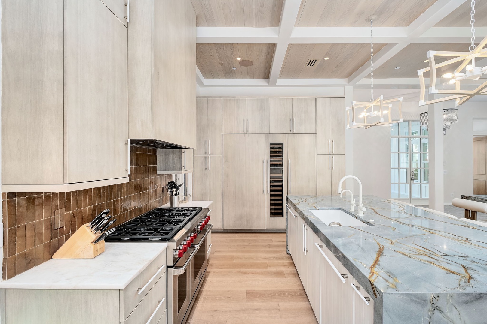 Step into your gourmet kitchen, where stunning marble countertops and modern appliances make every meal feel special. The warm wood tones and elegant lighting create a bright, welcoming space perfect for your culinary adventures.