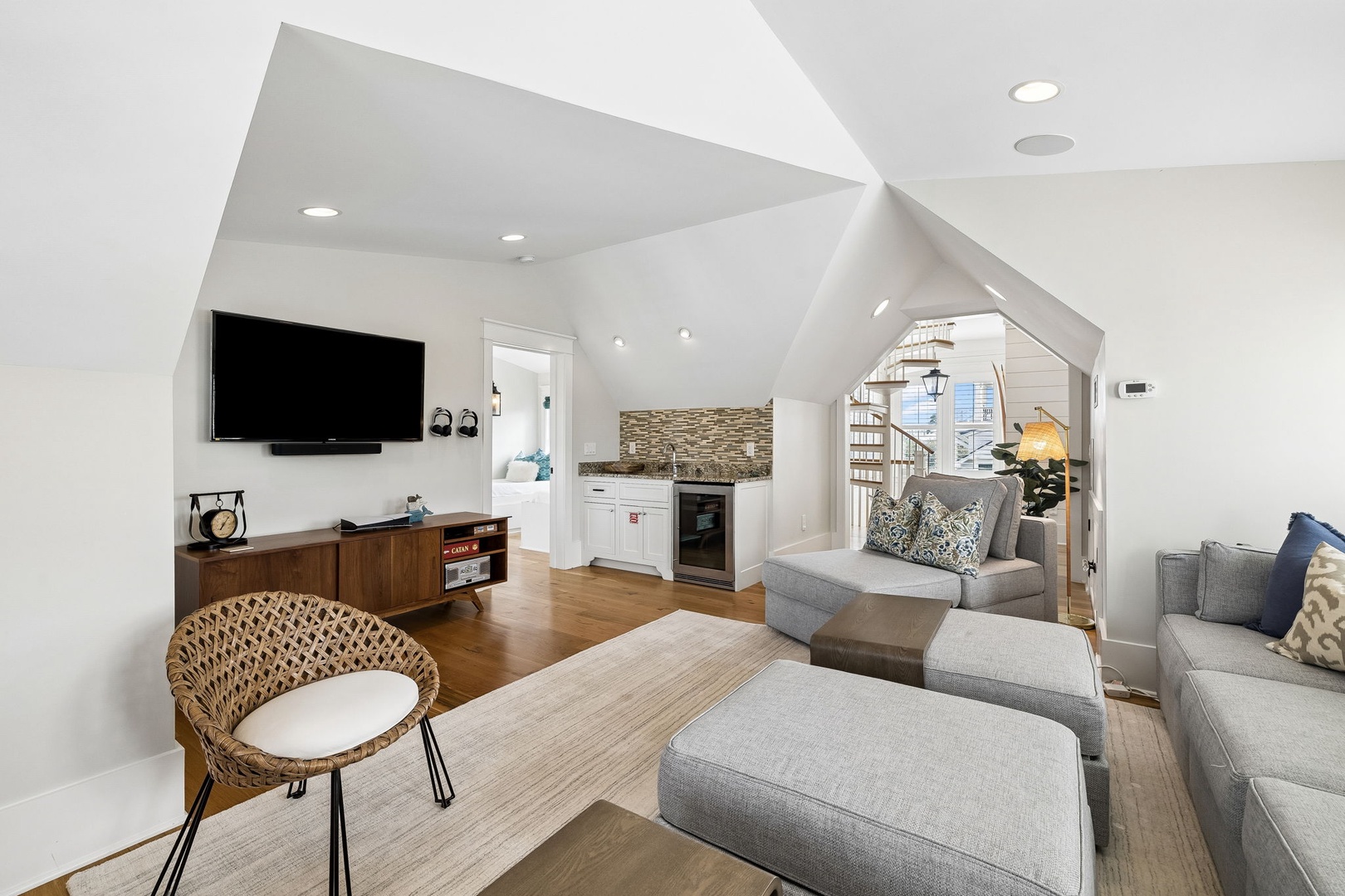 Relax in your light-filled living space with vaulted ceilings, modern kitchenette, and cozy seating perfect for unwinding after exploring.