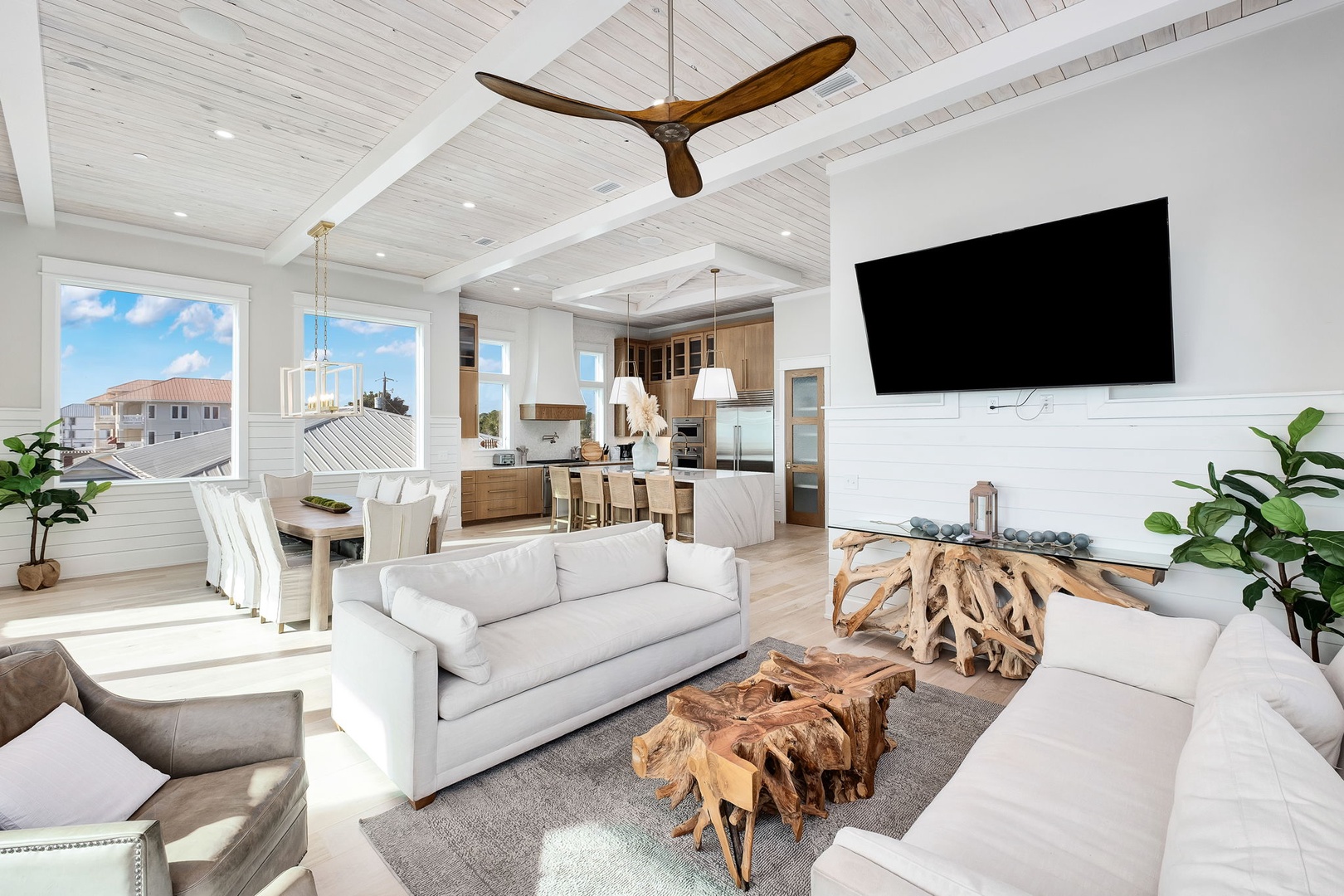 Relax in your bright open-concept living space with vaulted ceilings, cozy seating, and kitchen access for effortless vacation days.