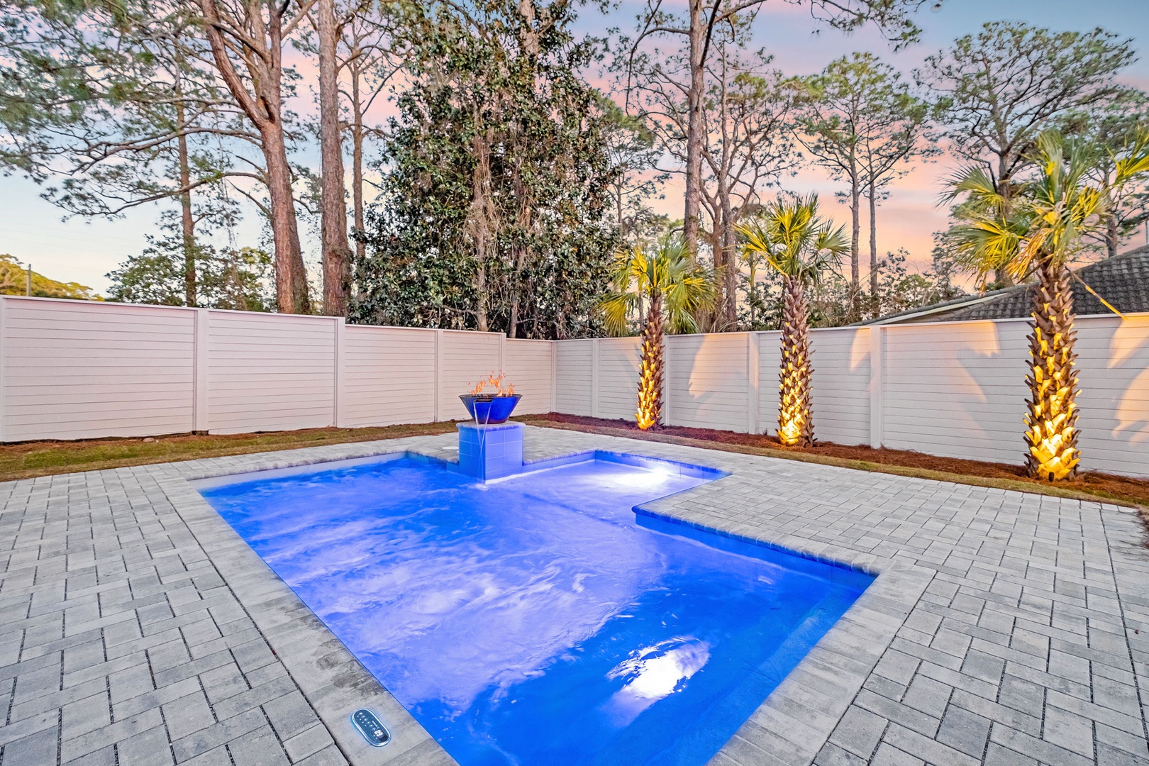 Slip into your private pool oasis as warm LED lighting creates a magical glow across the water at sunset.