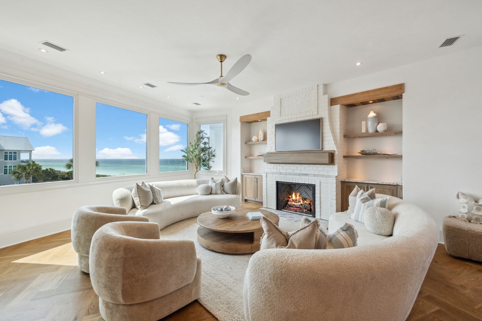 Sink into plush seating and let the ocean views wash over you—your coastal retreat awaits with warmth, elegance, and comfort at every turn.