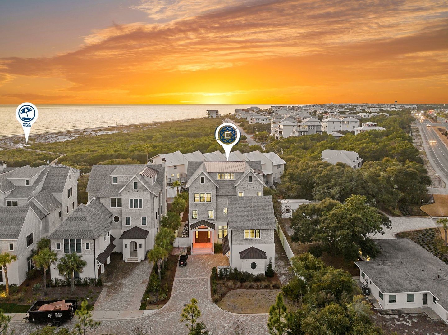 Stunning beachfront neighborhood captured during golden hour, showcasing coastal architecture and pristine shoreline access.