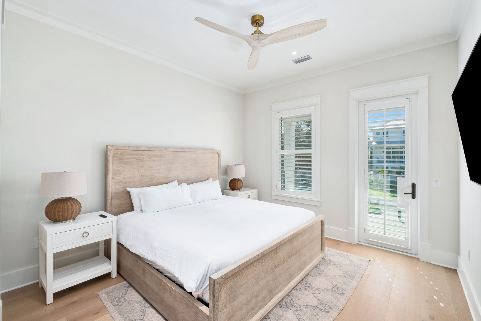 Slip into crisp white linens and drift off in your serene retreat, where soft coastal hues and natural light create the perfect escape. Your peaceful haven awaits.