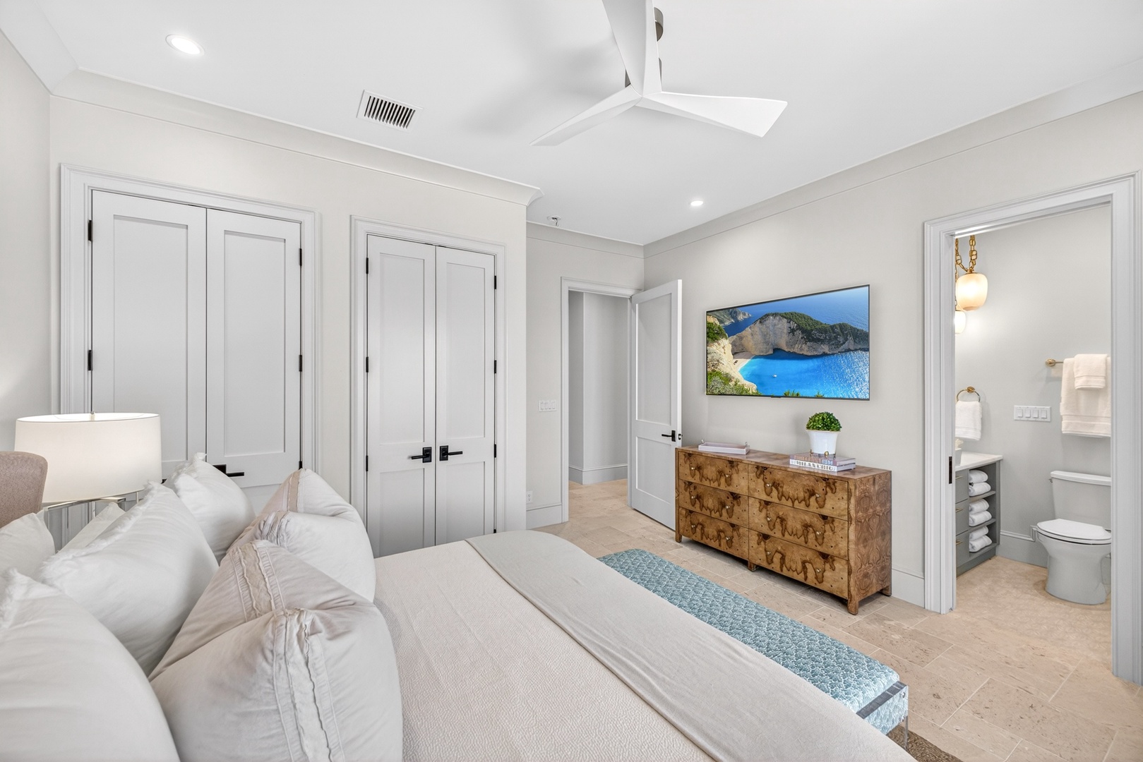 Unwind in your serene bedroom sanctuary, where plush linens invite restful nights and your private ensuite offers effortless convenience at every turn.